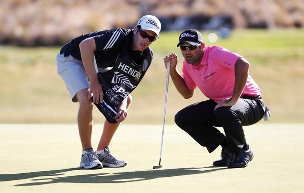 Current NZ PGA Championship title holder Michael Hendry with his caddy at last year's event.